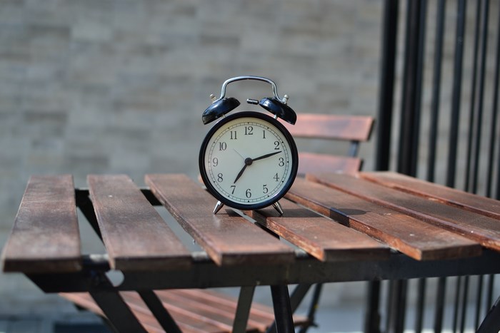 Vintage alarm clock on a wooden table