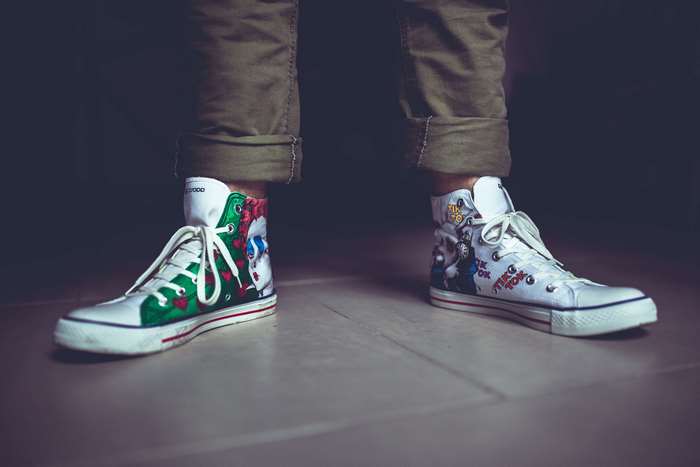 Person wearing custom clown-themed sneakers 4K