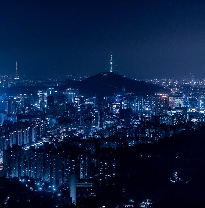 Nighttime View of Seoul City with Illuminated Tower
