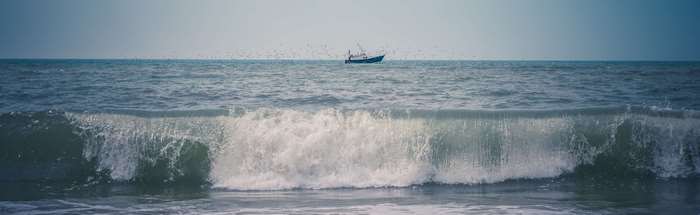 Boat in the ocean with a large wave, 4K panorama