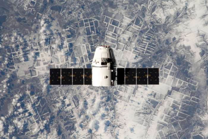 SpaceX Dragon spacecraft orbiting Earth