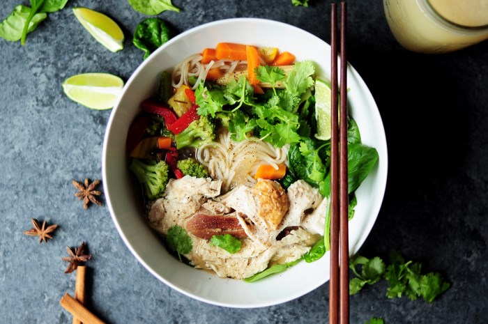 Bowl of noodle soup with chicken and vegetables