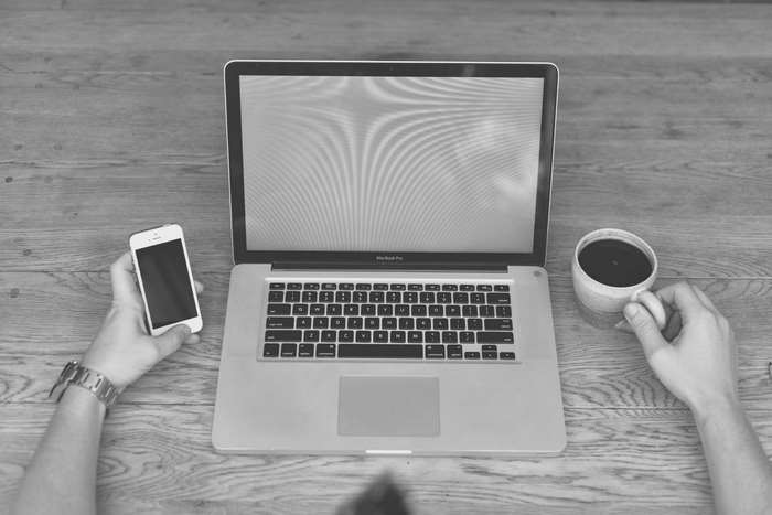 MacBook Pro with iPhone and Coffee