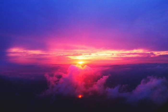 Sunset over clouds with vibrant colors