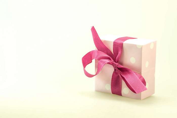 Pink polka dot gift box with ribbon