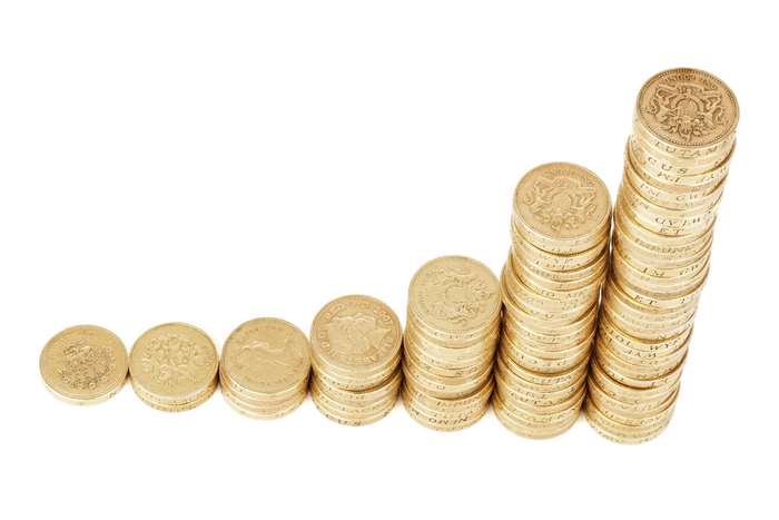 Stacks of British Coins Showing Financial Growth