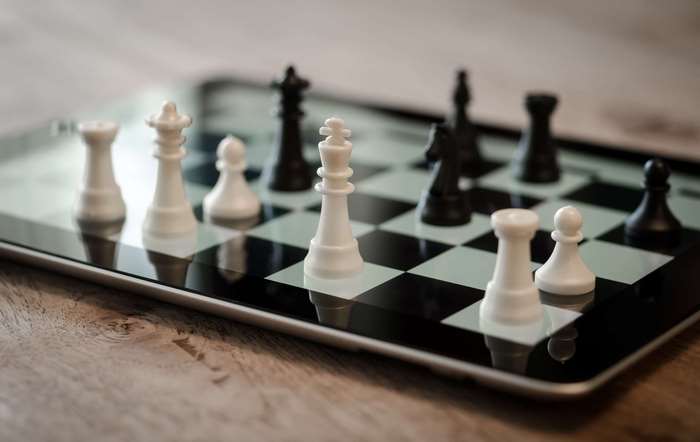 Chess pieces on a tablet screen