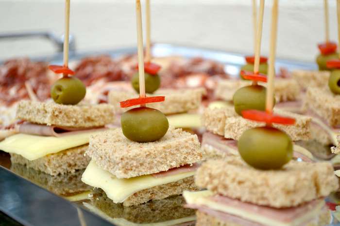 Sandwiches with olives and cheese on a tray 4K