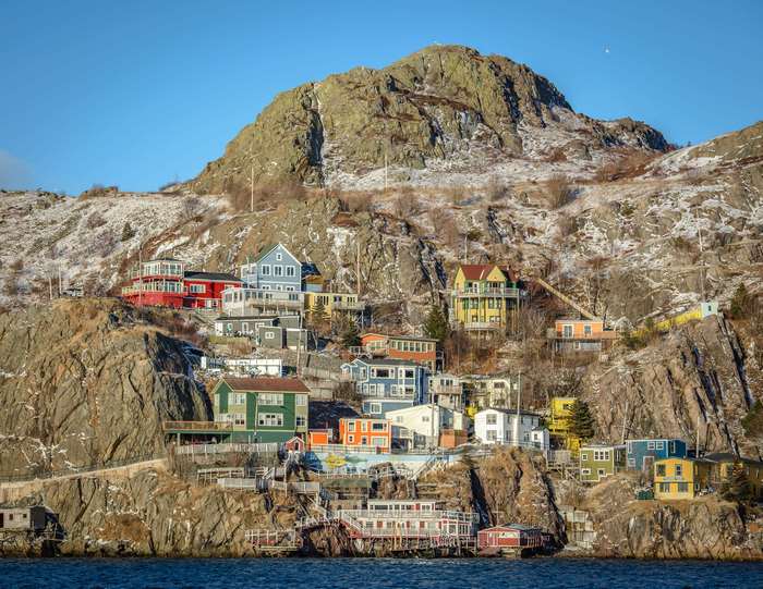 Colorful houses on a rocky hill in Newfoundland 4K