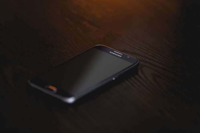 Samsung Galaxy S6 smartphone on a wooden table