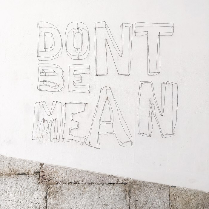 Street art quote "Don't Be Mean" in Lisbon