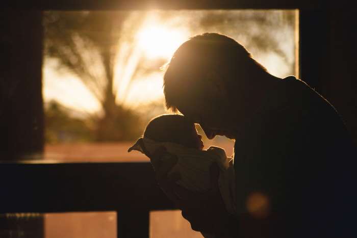 Father and Newborn Baby at Sunset 4K