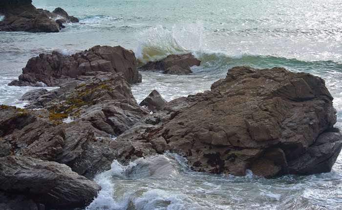Waves crashing on rocky coast in Cornwall
