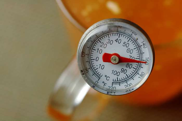 Close up of a thermometer measuring temperature
