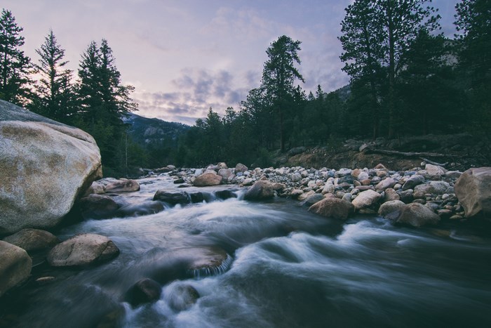 River flowing through a rocky forest landscape