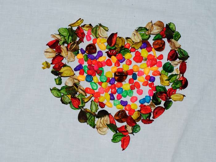 Colorful heart shape made of leaves and stones 4K