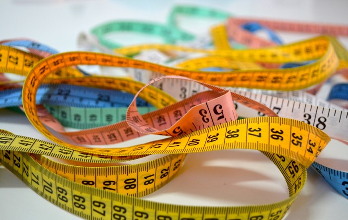 Pile of colorful measuring tapes