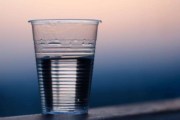 Plastic cup with water and condensation
