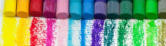 Colorful oil pastels and their strokes on paper