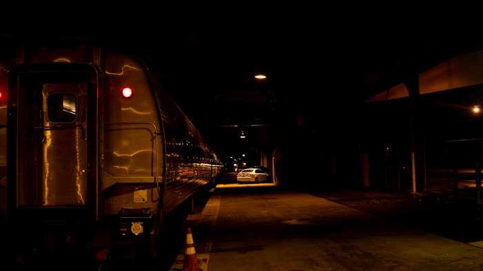 Train at a dark train station at night