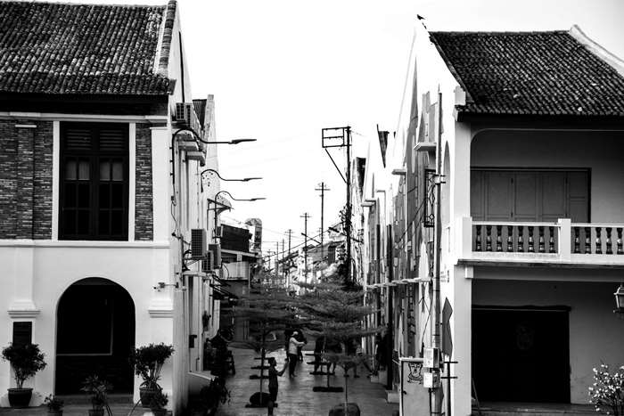 Black and white street with vintage buildings and graffiti 4K