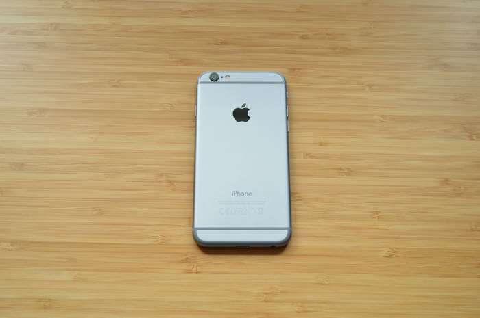 Silver iPhone 6 on a wooden surface