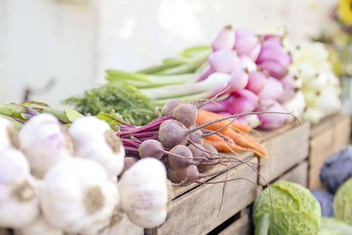 Beets, carrots, and other vegetables at a farmers market