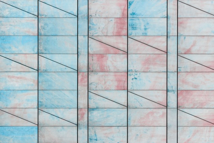 Abstract pattern of marble tiles with blue and pink marbling