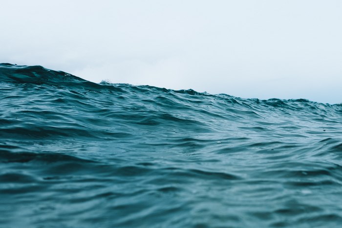 Calm Ocean Waves Under Overcast Sky