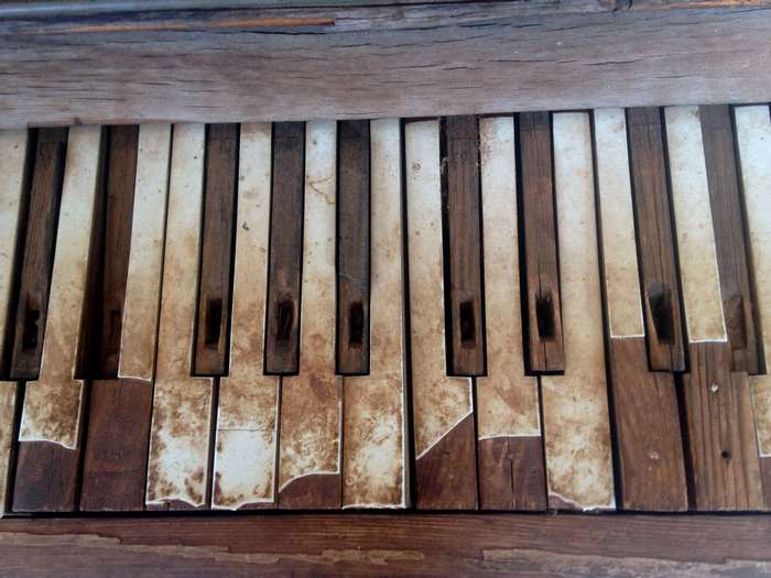 Close-up of old, damaged piano keys
