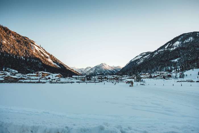 Snowy mountain village with ski slopes