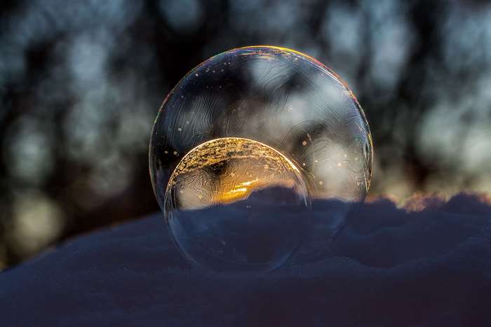 Close up of frozen liquid bubbles in snow