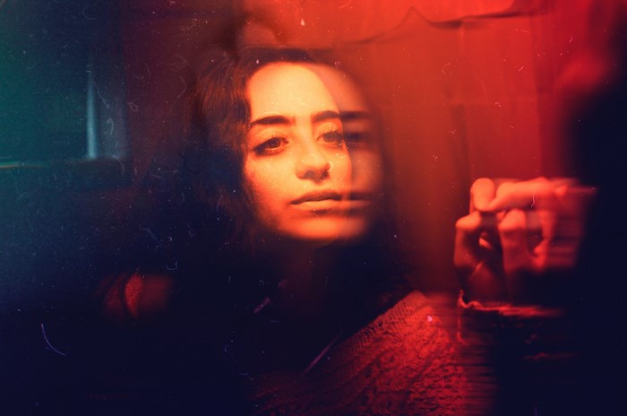 Woman with nose ring in double exposure