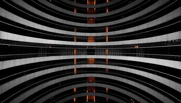 Abstract building with curved floors and orange lights