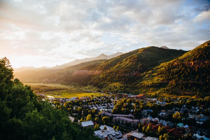 Sunrise over a mountain valley town