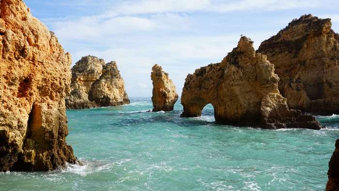 Jagged rock formations in the ocean near Lagos, Portugal