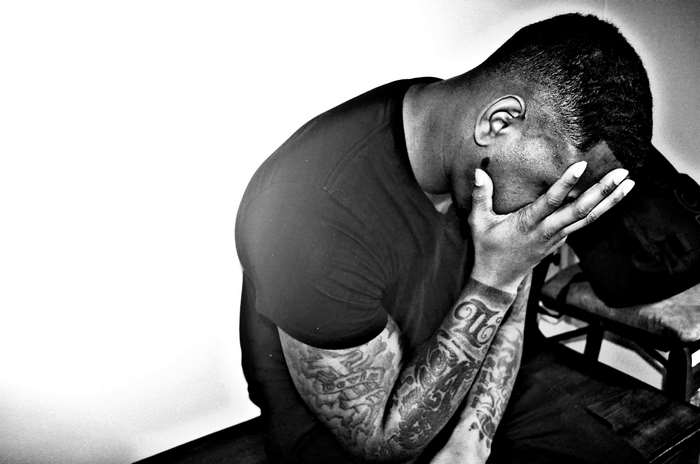 Man with tattoos covering his face