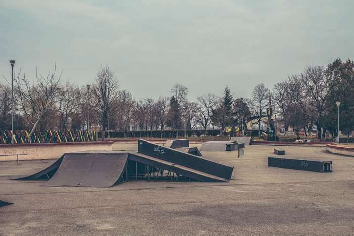 Empty Skatepark with Ramps and Trees