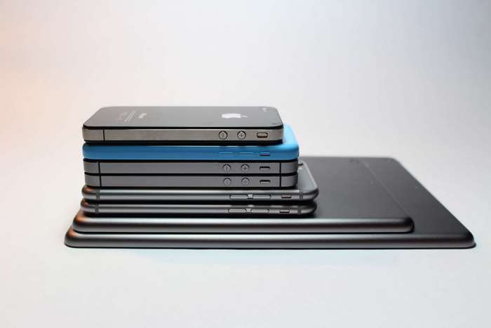 Stack of Apple iPhones and iPads