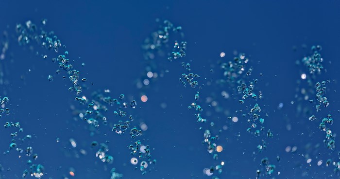 Blue abstract water bubbles and sparkles