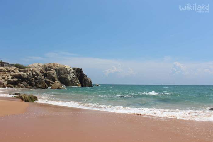 Muttom Beach with Rocky Outcrop and Blue Sea