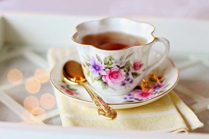 Vintage floral teacup with spoon and saucer