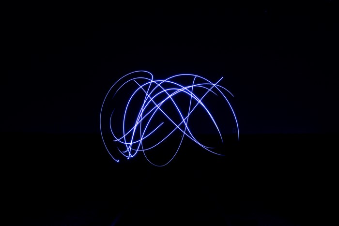 Blue light trails in a dark environment