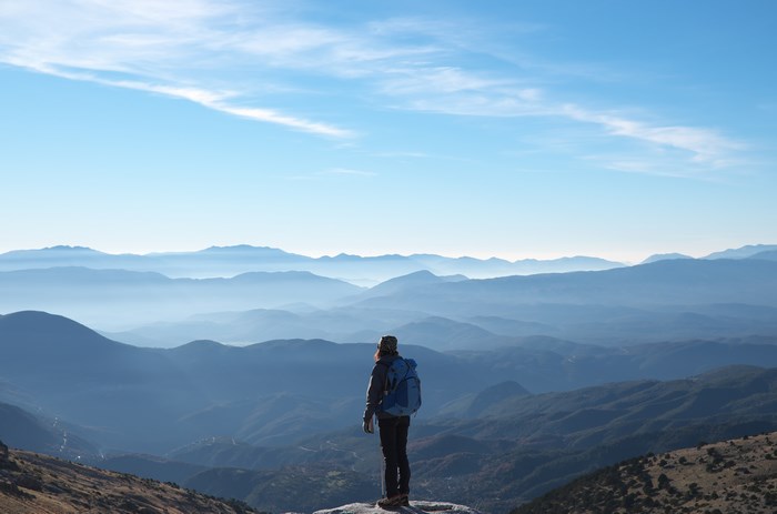 Backpacker on a mountain range in Greece