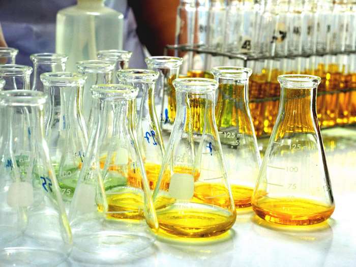 Laboratory glassware with yellow liquid