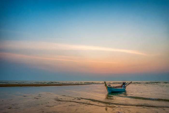 Boat on a beach at sunset