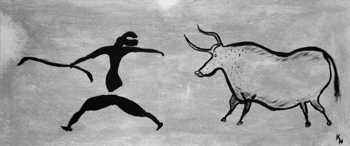 Cave painting of a human figure and a bull