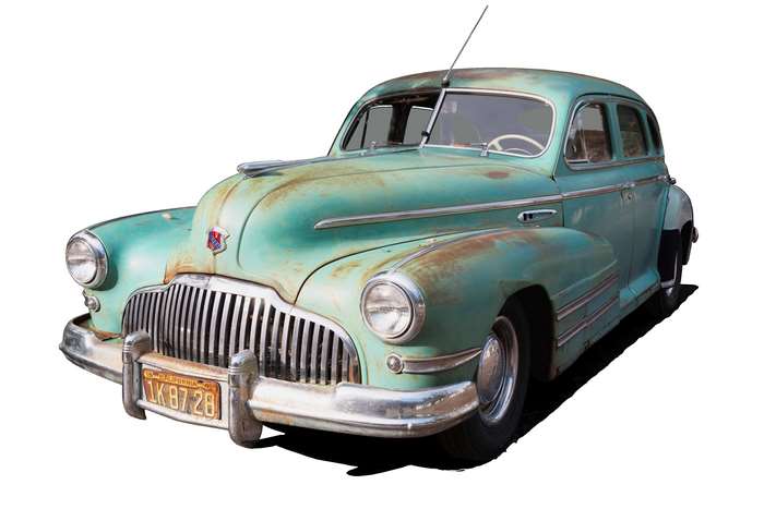 Vintage Teal Buick Sedan with Rusty Patches