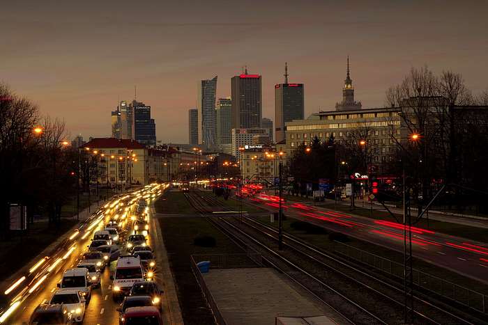 Warsaw cityscape with traffic at twilight
