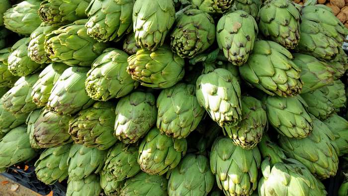 Pile of fresh green artichokes